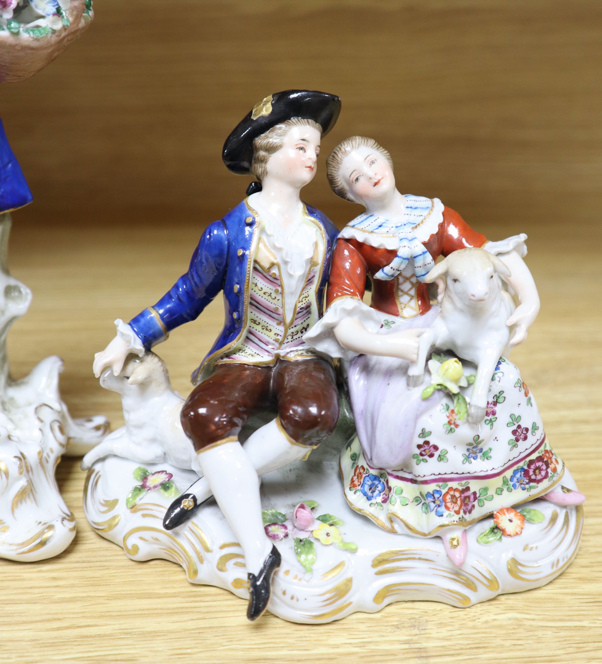 A Hochst porcelain shepherd and shepherdess group and four other modern Continental figures